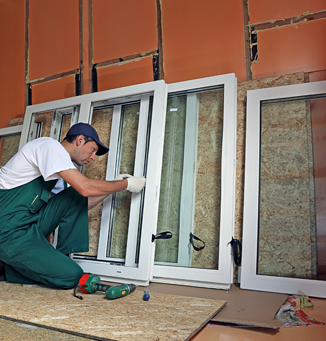 Worker Fixing Window Panels